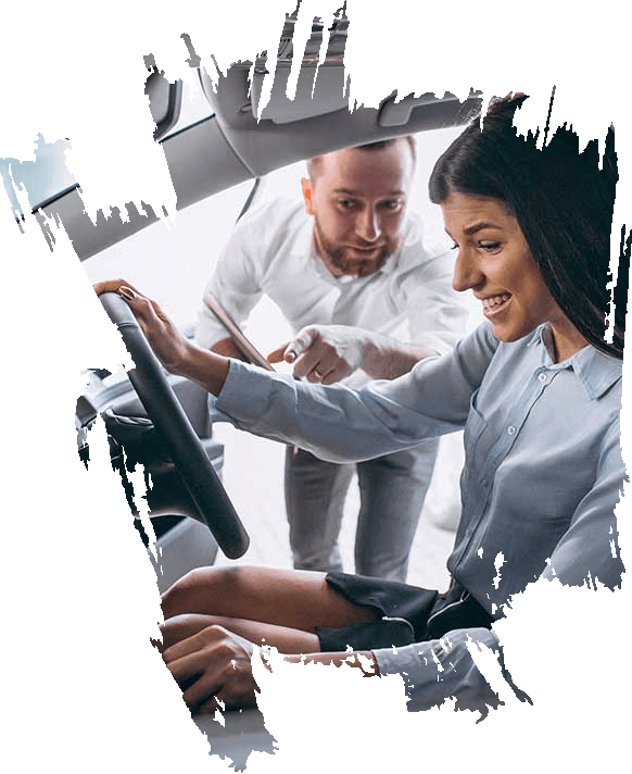 Driving instructor guiding a learner at the wheel during a lesson